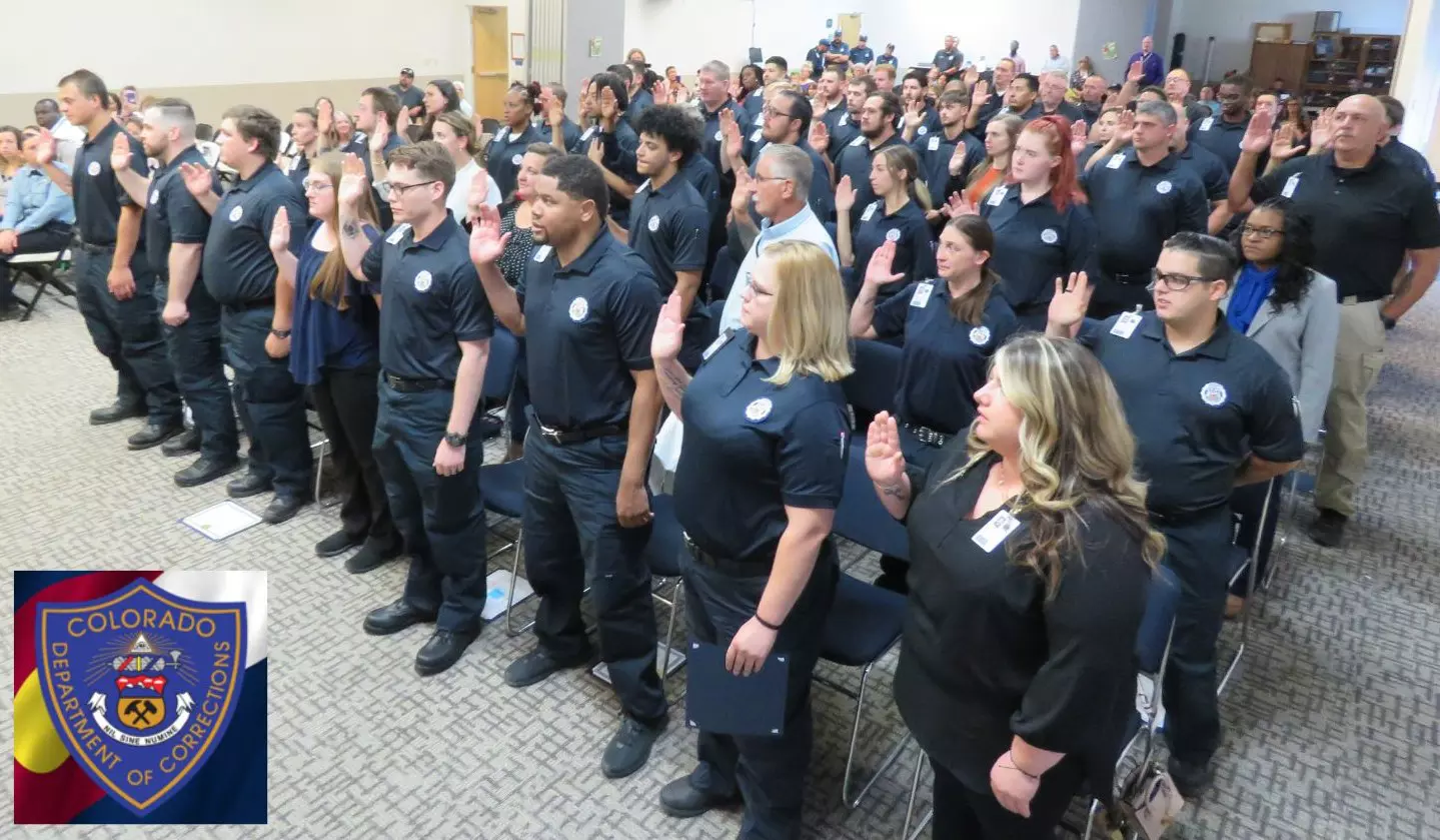 Staff raising right hand to swear and Oath of Service